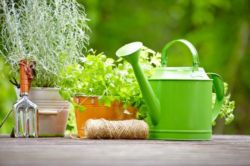 Professional garden maintenance team with safety equipment